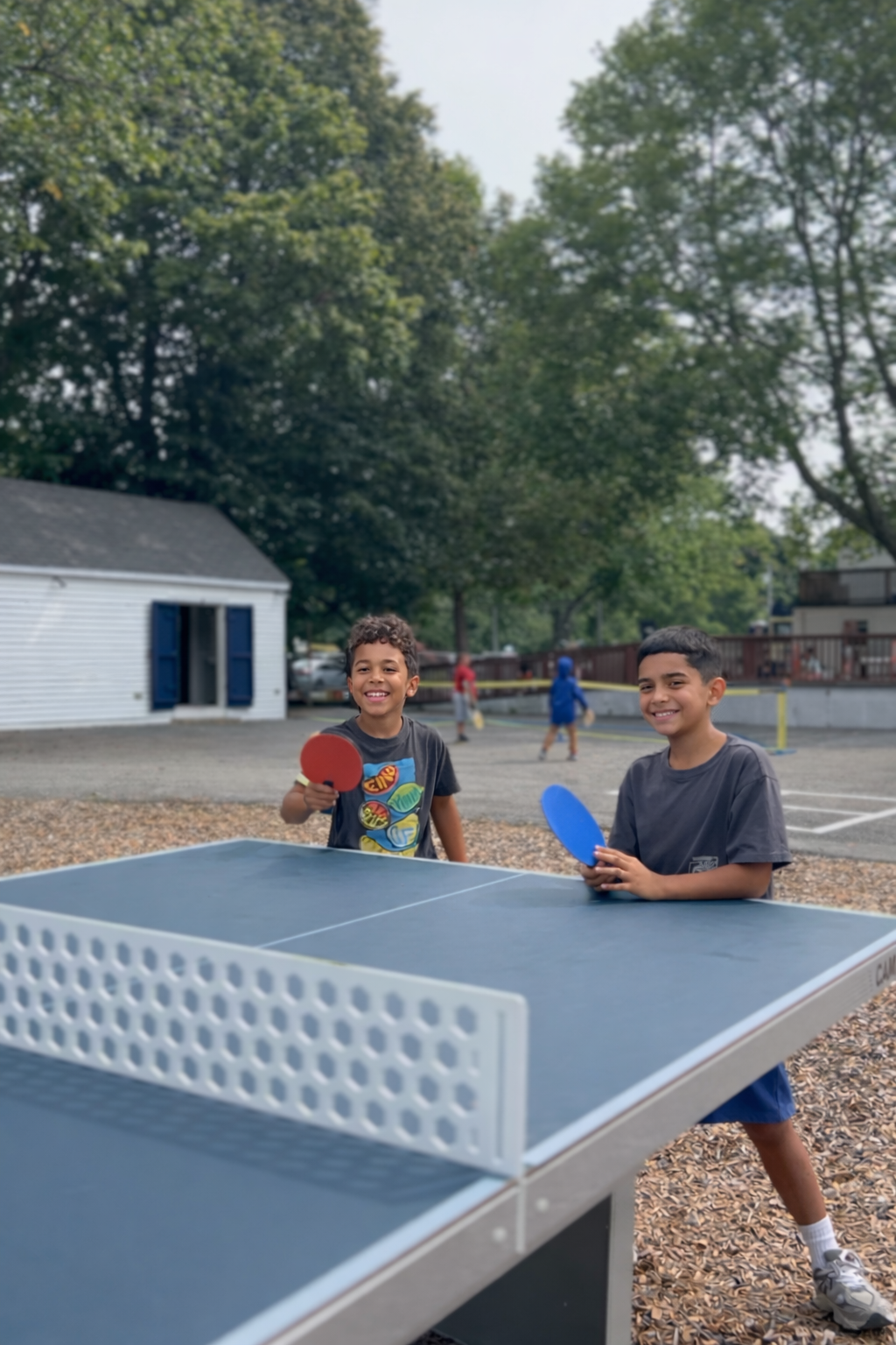 Boys playing ping pong at camp