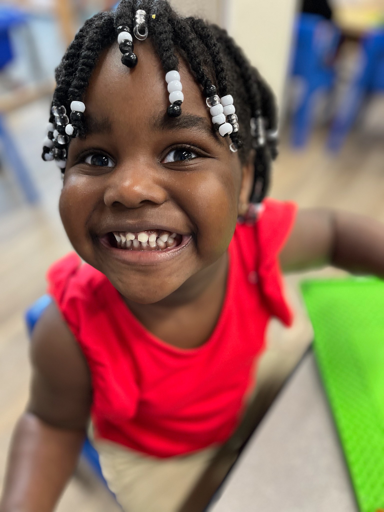 Child smiling in classroom