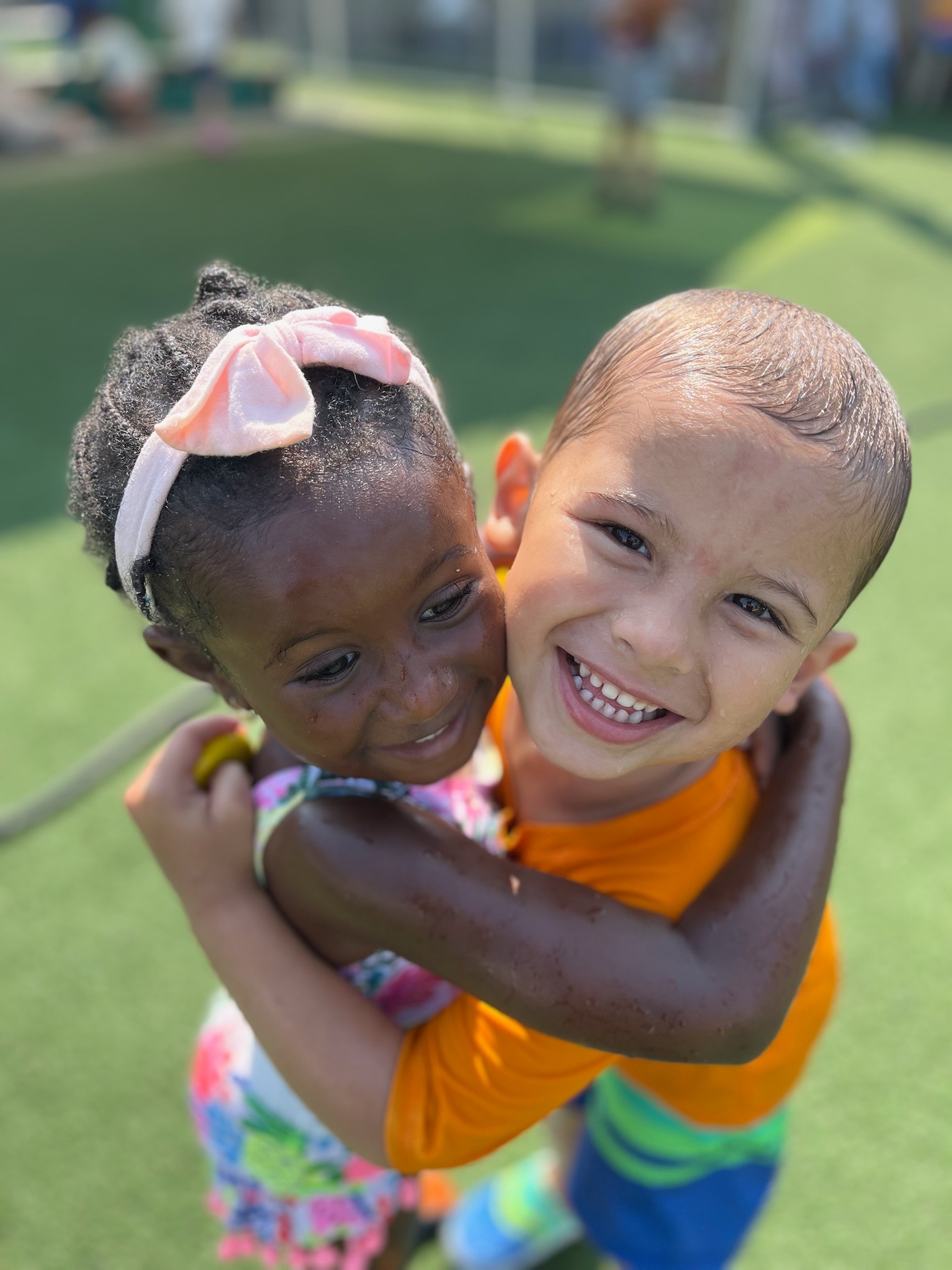 Friends hugging during outdoor play
